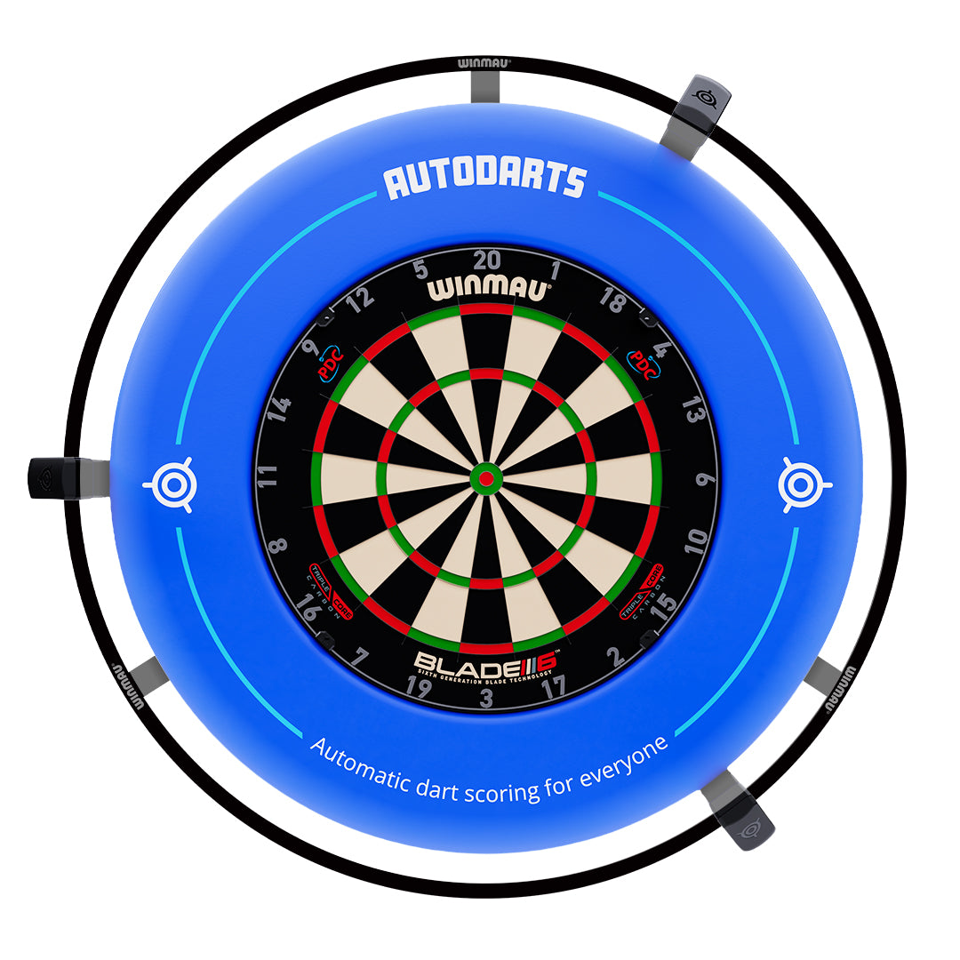 A blue circular dartboard surround with a mounted Winmau Blade dartboard in the center. The surround features the brand name 'AUTODARTS' at the top and text reading 'Automatic dart scoring for everyone' near the bottom, with target icons on the sides.