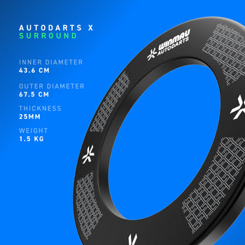 A black Autodarts X dartboard Surround  shown on a bright blue background with printed product specifications on the left and the surround itself angled on the right. The surround has white printed branding and geometric patterns.
Item specifications shown are Inner diameter 43.6cm, Outer diameter 67.5cm, thickness 25mm, weight 1.5kg. 